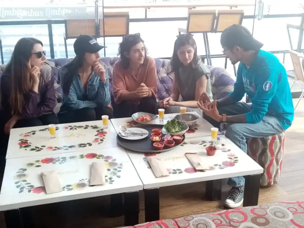 Trying a free pisco sour - free walking tour cusco - bloody bueno peru